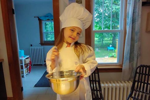 Georgia Wood, 10, dresses the part to bake cupcakes for animals in need.