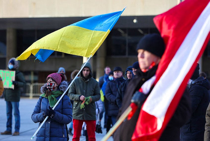 Ukrainian supporters rally after Russia launched a massive military operation against Ukraine, in Toronto February 24, 2022. 