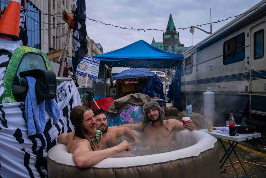  Demonstrators sit in a hot tub on Wellington during a protest that shut down the street and much of the downtown for several weeks.