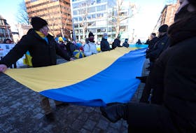 Feb. 26, 2022--A large Ukrainian flag is unrolled during a rally in the Grand Parade in Halifax Saturday. The show of support for Ukraine in front of Halifax City Hall called for peace in Ukraine as Russia continues its invasion.  The Nova Scotia government is donating $100,000 to the Canada-Ukraine Foundation to provide humanitarian aid and support to the people of Ukraine.
ERIC WYNNE/Chronicle Herald