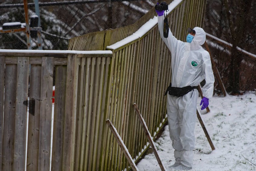 A forensic identification officer collects evidence at the scene of a suspicious death on Kennedy Drive in Dartmouth on Thursday, Dec. 16, 2021.
Ryan Taplin - The Chronicle Herald