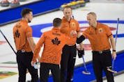 The members of Brad Gushue's St. John's team, (from left) Brett Gallant, Gushue. Geoff Walker and Mark Nichols, celebrate a win  at the Tim Hortons Trials in Saskatoon.   — Curling Canada photo/Michael Burns