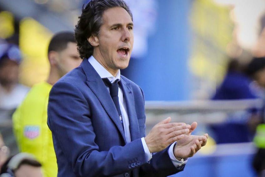 Montreal Impact head coach Mauro Biello claps for one of his players during second half against the Portland Timbers in Montreal on May 20, 2017. 
