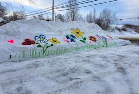 Whimsical art in the snow was painted on a snowbank in the Hennigar’s Farm Market parking lot in Greenwich on Feb. 2.