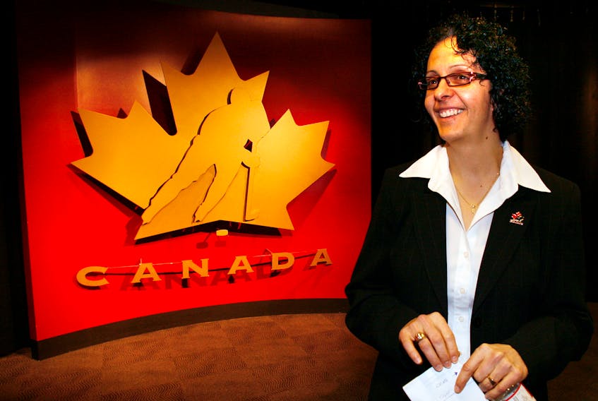 Danielle Goyette smiles after announcing her retirement from the Canadian Women's Olympic Ice Hockey team in Calgary on Jan. 16, 2008. On Thursday, Feb. 3, she joined the Newfoundland Growlers as the first female assistant coach to take the bench in ECHL history. REUTERS/Todd Korol (CANADA)