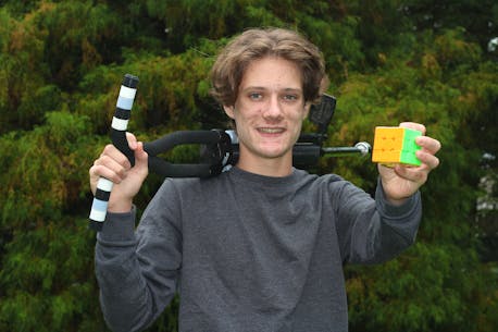 Annapolis Royal, N.S., teenager sets Guinness World Record for solving Rubik’s Cubes while on a pogo stick.