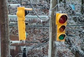 Icicles hang from a traffic light without power at the intersection of George St. and Dorchester St. in downtown Sydney on Saturday. JESSICA SMITH/CAPE BRETON POST