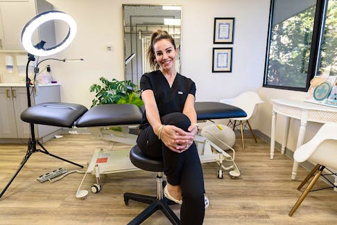 Jody Stoski, cosmetic and paramedical tattoo artist, poses for a photo at her office at Cinnamon Girl Clinic on Thursday, January 27, 2022. 