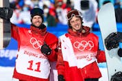 Gold-medallist Max Parrot of Team Canada (L) and bronze medalist Mark McMorris of Team Canada celebrate during the Men’s Snowboard Slopestyle Final on Day 3 of the Beijing 2022 Winter Olympic Games.