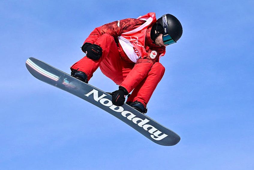 Canada's Max Parrot competes in the snowboard men's slopestyle final run during the Beijing 2022 Winter Olympic Games.
