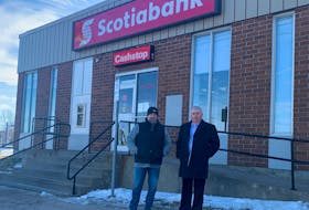 Dave Julian, right, president and CEO of New Deal Development Centre Ltd., and CBRM Dist. 1 Coun. Gordon MacDonald stand in front of the Scotiabank branch in Sydney Mines. The bank is closing in June and New Deal is hoping to acquire the building for $1 so it can expand its non-profit work in the community. Chris Connors/Cape Breton Post