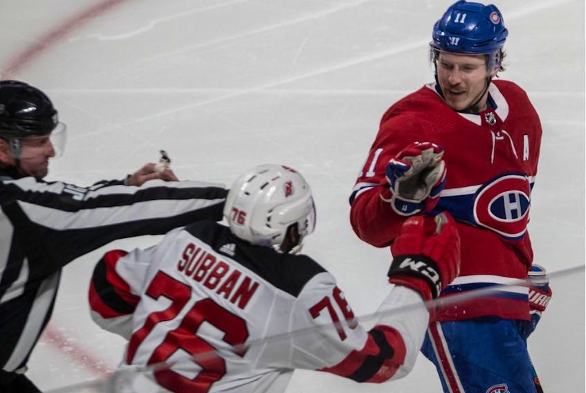 Montreal Canadiens right-winger Brendan Gallagher and New Jersey Devils defenceman P.K. Subban have words after tangling in the faceoff circle during third period at the Bell Centre in Montreal on Nov. 28, 2019.