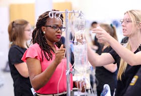 Damilola Iduye, left, instructs a nursing student at Dalhousie University. Iduye is one of two African people currently teaching nursing at Nova Scotia universities. CONTRIBUTED/DALHOUSIE UNIVERSITY 