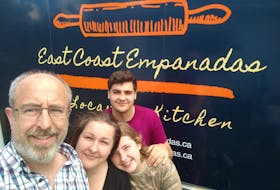 Bettina Hartenstein, second from left, her husband Holger Hartenstein and sons Lukas and Jean, back, pose in front of their food truck East Coast Empanadas, which is currently operating out of South Haven in Victoria County. The business has been serving up the Latin American staple to people in Cape Breton since June. Contributed