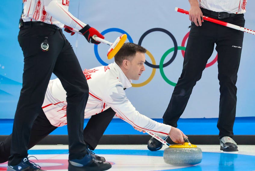  Team Canada skip Brad Gushue throws last rock in the team’s first game in men’s curling against Denmark at the Beijing 2022 Winter Olympics on Wednesday, February 9, 2022.