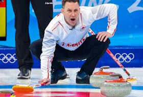 Team Canada skip Brad Gushue calls out in the team’s first game in men’s curling against Denmark at the Beijing 2022 Winter Olympics on Wednesday, February 9, 2022. 
