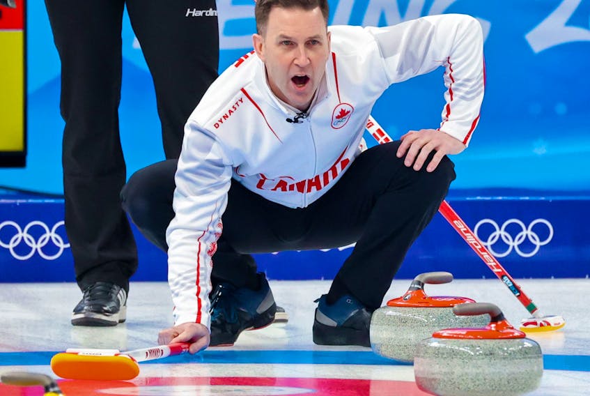 Team Canada skip Brad Gushue calls out in the team’s first game in men’s curling against Denmark at the Beijing 2022 Winter Olympics on Wednesday, February 9, 2022. 
