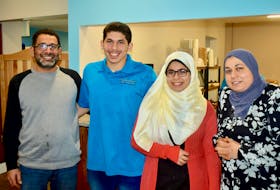 The Geisa family in better times. The above photograph was taken on the first day of business at Sydney’s Khufu Restaurant and Bakery in December 2018. From left, Ibrahim Geisa, son Ammar who attends Mount Allison University, daughter Rehaf who is a CBU graduate working for a pharmaceutical company in P.E.I., and wife Rehab Elwan. The Egyptian couple also has another son and daughter not pictured. DAVID JALA/CAPE BRETON POST