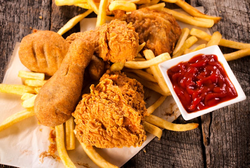 Planning a Super Bowl menu? Chicken wings or chicken tenders are a familiar favourite. - Storyblocks