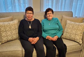 Terry Penny (left) and her mother, Velma (Duckie) MacDougall sit together at Velma’s Cove Retirement Living apartment, where Velma has made many friends. “I get up every morning looking forward to visiting with the girls,” she says. “We have so many laughs.” 
PHOTO CREDIT: Contributed