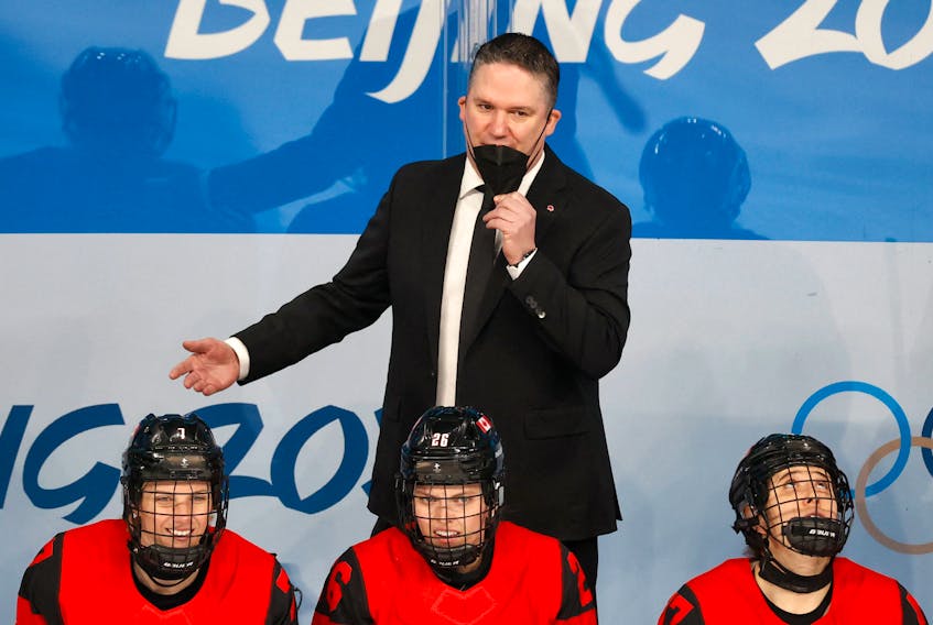 Team Canada head coach Troy Ryan argues a call during the Olympic gold medal game against the United States on Feb. 17 in Beijing. - DAVID W. CERNY / REUTERS