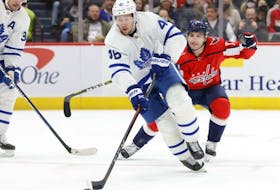 Feb 28, 2022; Washington, District of Columbia, USA; Toronto Maple Leafs defenseman Ilya Lyubushkin (46) skates with the puck as Washington Capitals left wing Conor Sheary (73) chases in the first period at Capital One Arena.  