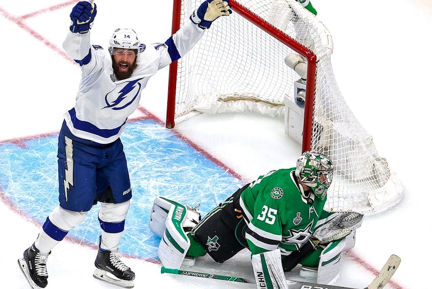 Pat Maroon (14) of the Tampa Bay Lightning celebrates a goal by teammate Blake Coleman (not pictured) past Anton Khudobin (35) of the Dallas Stars in Game 6 of the 2020 NHL Stanley Cup final at Rogers Place on Sept. 28, 2020, in Edmonton.
