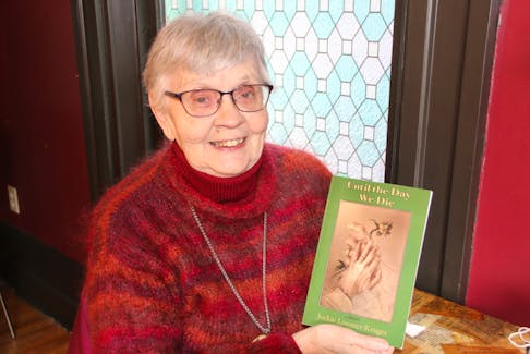 Jockie Loomer-Kruger holds a copy of her novel, Until the Day We Die.’ She has been writing since she was a child but this is her first novel. LYNN CURWIN PHOTO