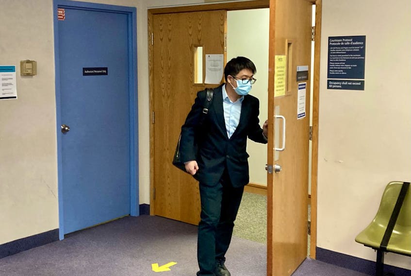 Acupuncturist Xiao Han Li leaves Dartmouth provincial court Thursday during a break at his trial on a charge of sexual assault.