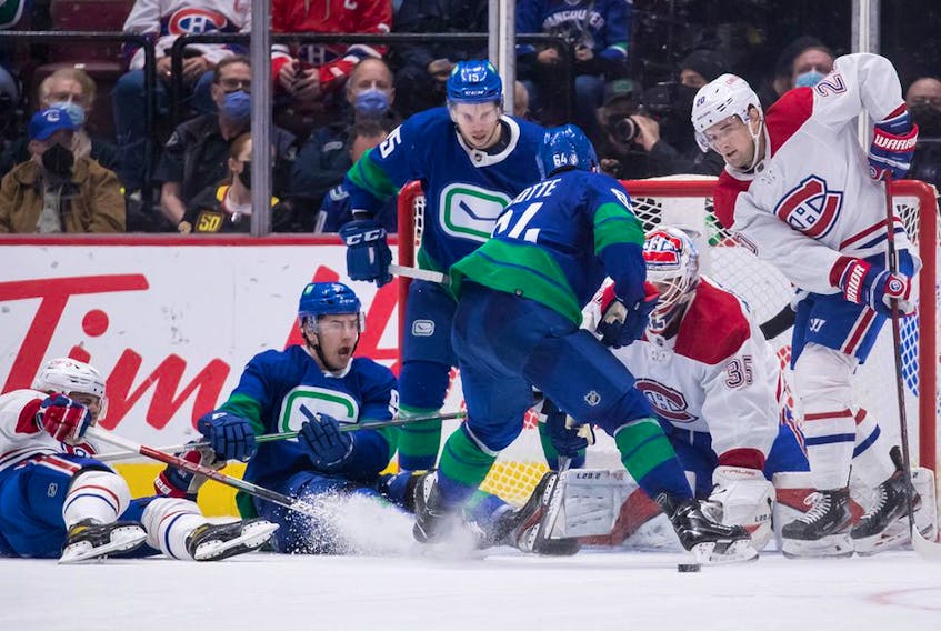 Montreal Canadiens goalie Sam Montembeault stops Vancouver Canucks' Tyler Motte (64) during the second period in Vancouver on March 9, 2022.