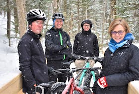 Mark MacNutt (left), Christian Bucher, Thomas Bucher and Janice Bucher from Mountain Bike Trail Builders Pictou County come together on a snowy March morning to talk about work done, and the enjoyment to be had, on the Fitzpatrick Mountain Trails.