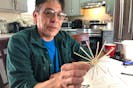 54-year-old Virick Francis, holding the bottom of a tiny basket in progress, learned the art of Mi'kmaq basketry from his mother and grandmother, watching them as a child. He has now mastered the craft and said each basket is one-of-a-kind. ARDELLE REYNOLDS/CAPE BRETON POST
