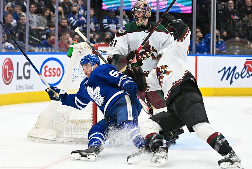 Toronto Maple Leafs forward Michael Bunting collides with Arizona Coyotes defenceman Shayne Gostisbehere.