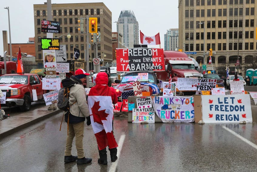 Demonstrators from the convoy protest movement gather on Wellington Street in Ottawa on Feb. 10.