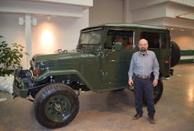 Craig MacDonald stands beside a Landcruiser that was rebuilt by Bespoke Motor Company in New Glasgow.