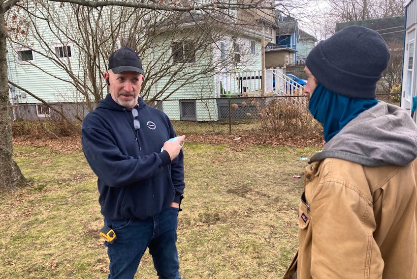 Dan Ross, left, shares a conversation with Danny Saulnier at Saint Theresa Catholic Church in Halifax, the site of two emergency shelters built by the Archdiocese of Halifax-Yarmouth.