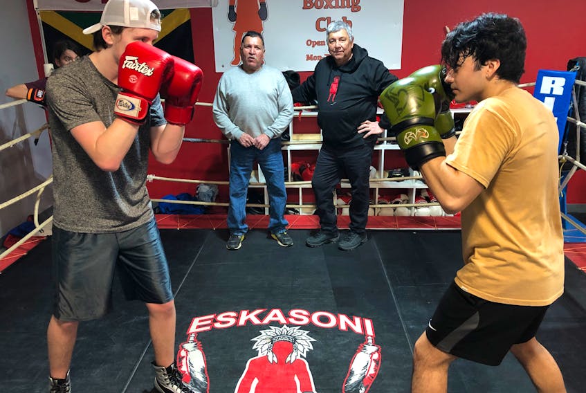 A new recruit to boxing, 15-year-old Ashton Greencorn from Louisdale, left, faces off against Israel Regalado, right, a 21-year-old boxer from Eskasoni as their coaches, brothers Dale and Barry Bernard look on. Both young boxers are preparing for a card in Port Hawkesbury in May. ARDELLE REYNOLDS/CAPE BRETON POST