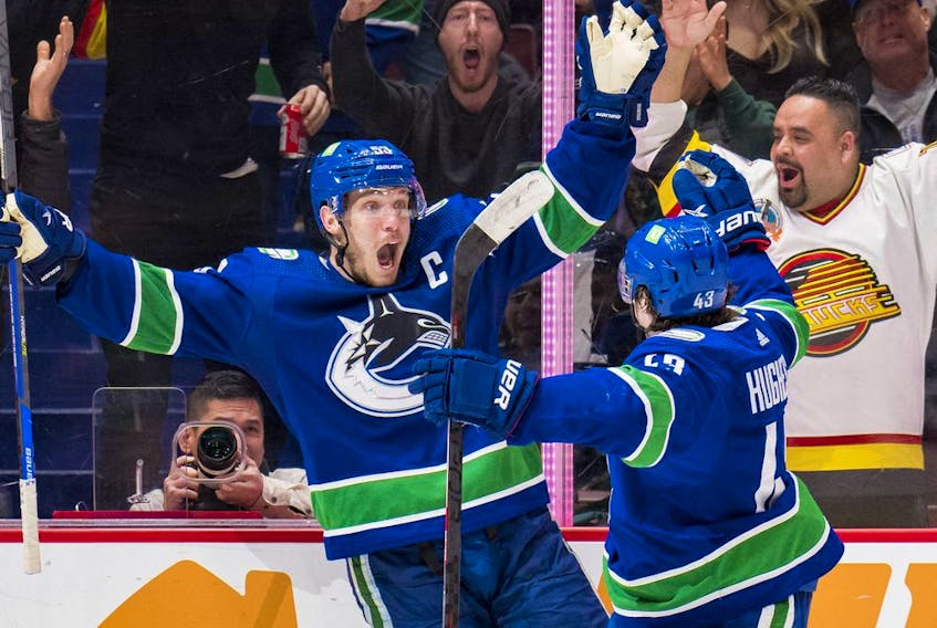 Vancouver Canucks forward Bo Horvat (53) and defenseman Quinn Hughes (43) celebrate Horvat's second goal of the game against the Washington Capitals in the third period at Rogers Arena. Capitals won 4-3 in overtime. Photo: Bob Frid-USA TODAY Sports