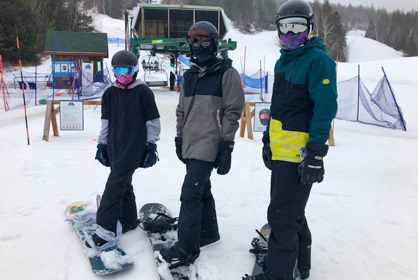 Dasan Toney, 14, right, and Scott Denny Stevens, 15, centre, both from Esksoni, joined their friend Anna MacIntosh from Port Morien on the slopes in Ben Eoin on Saturday morning. ARDELLE REYNOLDS/CAPE BRETON POST