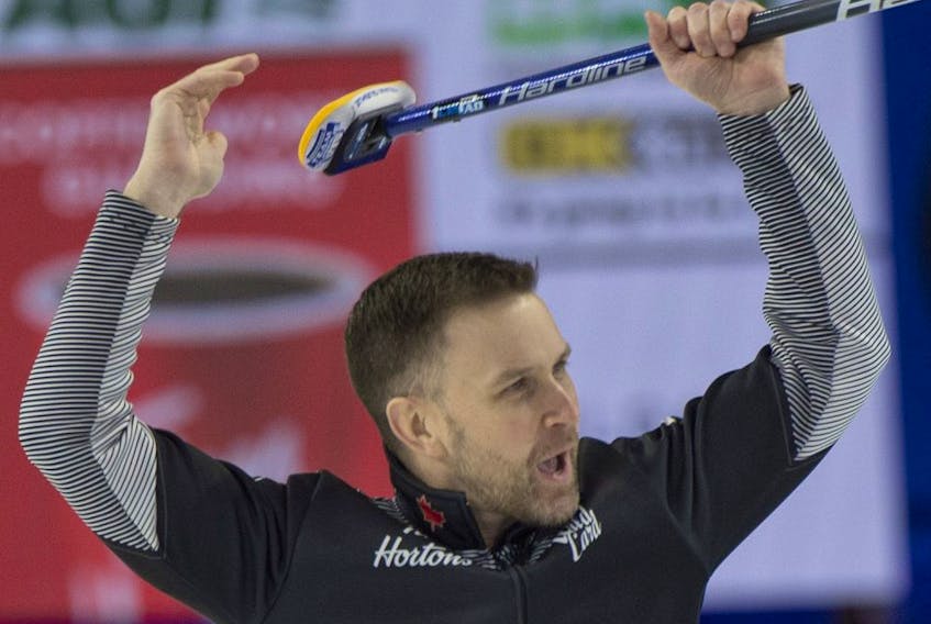 Team Wild Card 1 skip Brad Gushue celebrates after defeating Saskatchewan 9-7 in the Page Playoff 3vs4 game at the Tim Hortons Brier in Lethbridge on March 12, 2022.