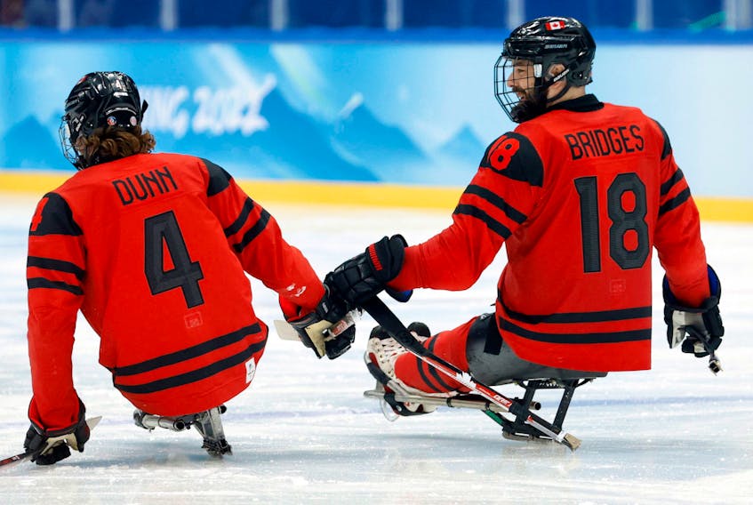 National Para Hockey Team forward James Dunn, left, and Summerside-born Billy Bridges celebrate scoring their fifth goal against South Korea at the National Indoor Stadium in Beijing, China, during the 2022 Winter Paralympic Games March 11. Bridges earned his fourth Paralympic medal after Canada took home silver after a 5-0 loss to the U.S. in the gold-medal game on March 13.