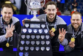 Team Wild Card One skip Brad Gushue, left, second Brett Gallant, centre, and lead Geoff Walker celebrate their victory over Team Alberta at the Tim Hortons Brier in Lethbridge, Alta., Sunday, March 13, 2022.  