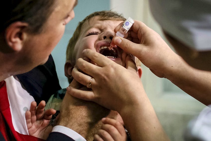 A boy receives polio vaccine drops at a clinic in Kiev, Ukraine in 2015. - REUTERS/Gleb Garanich/File Photo
