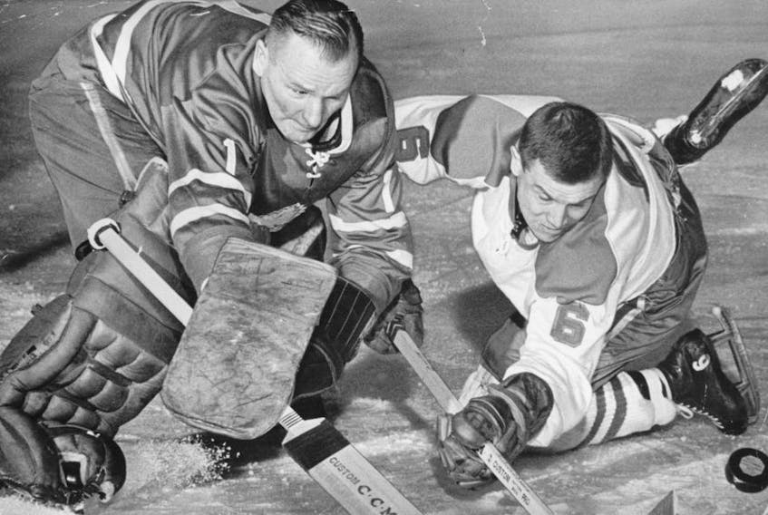 Former Canadiens great Ralph Backstrom, right, battles for a loose puck with Leafs legend Johnny Bower during their heyday. The late Backstrom had also suffered from Lewy Body Dementia and CTE. SUN FILES