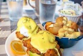 The buttermilk fried chicken eggs benedict at Claudine’s Eatery in Fredericton is made even richer with thick slices of avocado, and a side of home fry poutine. Gabby Peyton photo