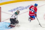 Montreal Canadiens centre Jake Evans (71) leaps in front of Arizona Coyotes goaltender Karel Vejmelka (70) to avoid a shot from the point during 3rd period NHL action at the Bell Centre in Montreal on Tuesday, March 15, 2022.