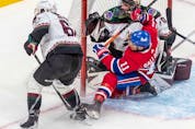 Montreal Canadiens right wing Brendan Gallagher (11) crashes into Arizona Coyotes goaltender Karel Vejmelka (70) during 1st period NHL action at the Bell Centre in Montreal on Tuesday, March 15, 2022.