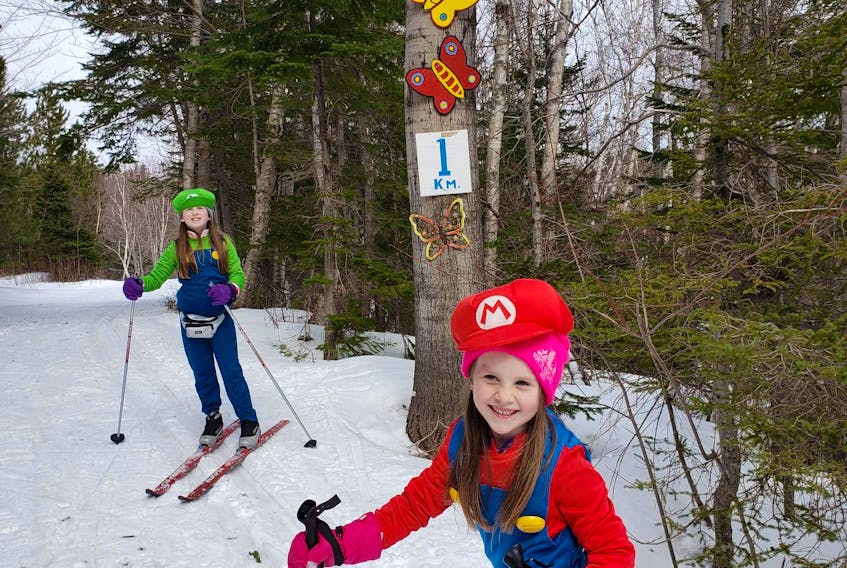 It was sunny and mild for March break skiing at North Highlands Nordic Ski Club in Cape North Tuesday. Sisters Ainsley and Ashlyn Hawley of Halifax were the lucky winners of the crazy costume contest dressed as Mario and Luigi during their time on the trails. Prizes were two handmade monkey hats. CONTRIBUTED