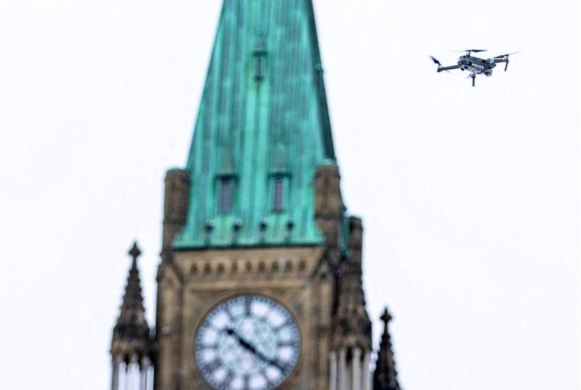 A police drone flies near Parliament Hill as police work to evict the last of the trucks and supporters occupying the downtown core on Feb. 20.