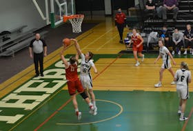 UPEI Panthers centre Carolina Del Santo, 15, attempts to block a shot attempt by the Acadia Axewomen’s Sarah Delorey, 13, in an Atlantic University Sport (AUS) women’s basketball game in Charlottetown on March 5. UPEI opens play in the AUS basketball championships on March 17.
